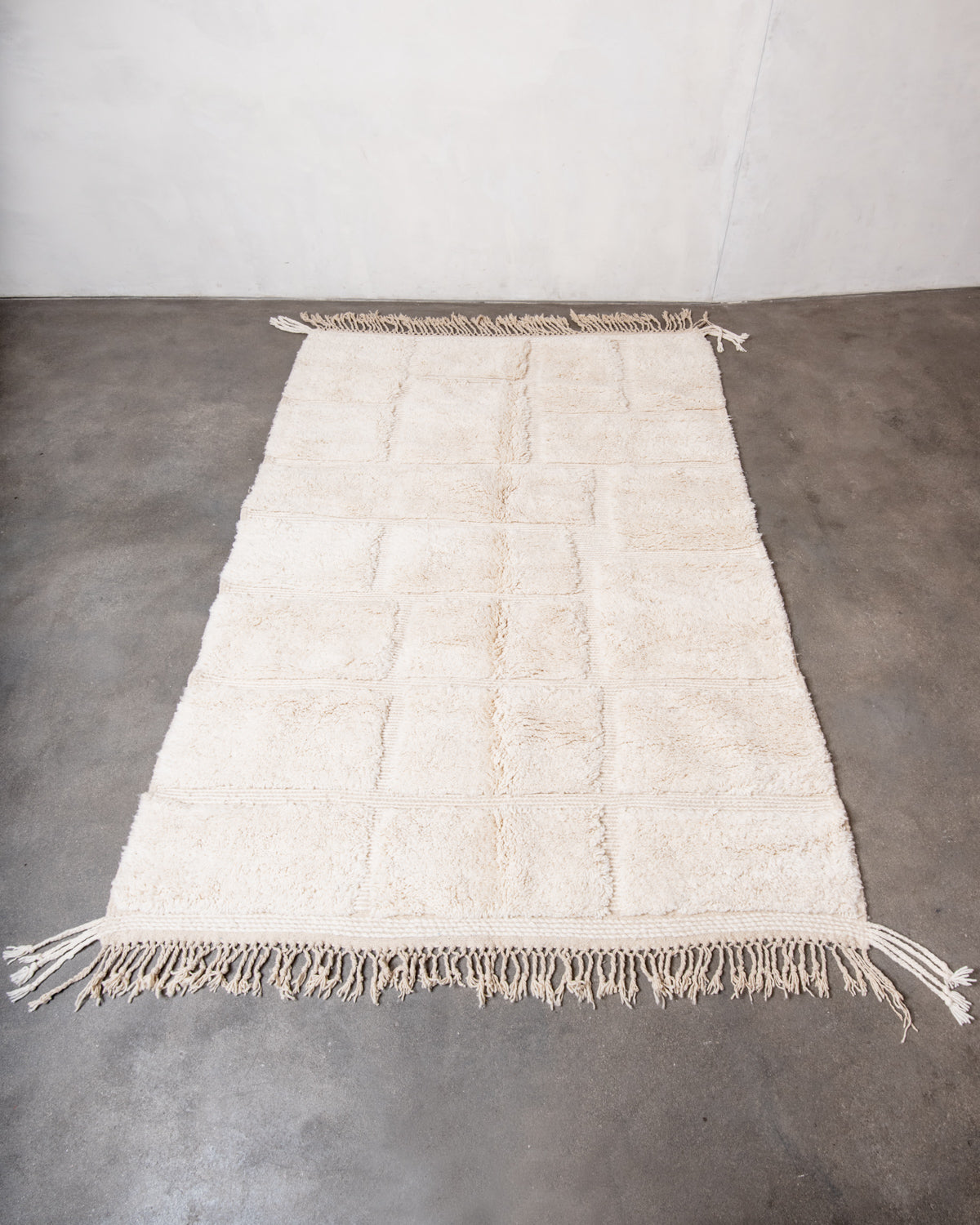 Modern, designer, handcrafted Berber rug from Morocco. Beniourain carpet with minimalist design, natural wool pile and a fluffy texture.